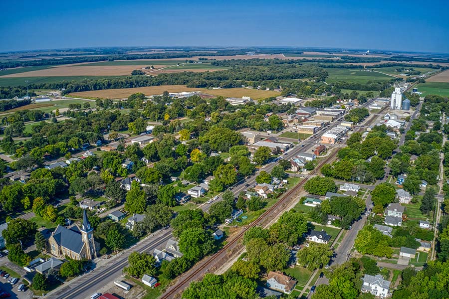 Contact - Aerial View of the Small Town of London Kentucky on a Sunny Summer Day with Green Foliage Surrounding Homes and Businesses